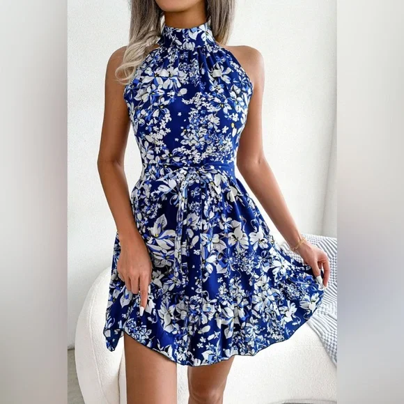 Tina - Vestido acampanado con dobladillo con volantes y cintura con lazo floral