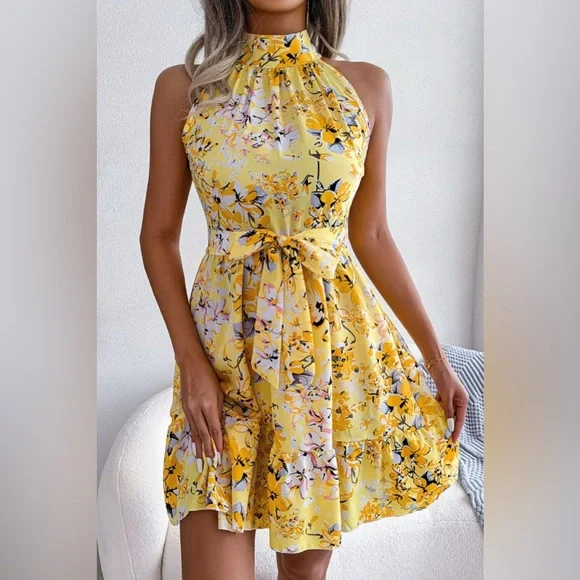 Tina - Vestido acampanado con dobladillo con volantes y cintura con lazo floral