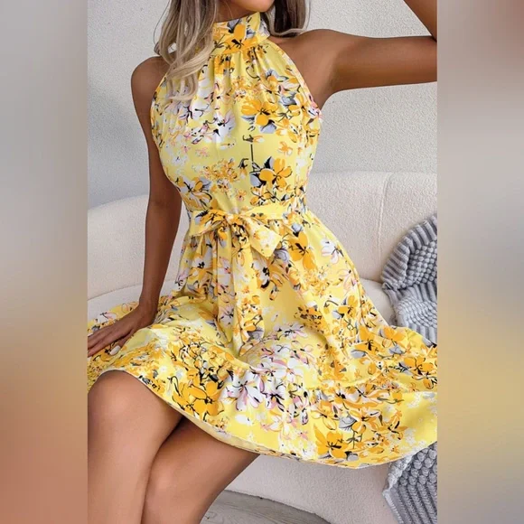 Tina - Vestido acampanado con dobladillo con volantes y cintura con lazo floral